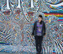 Skye Mayring in front of the Berlin Wall East Side Gallery // © 2011 Skye Mayring